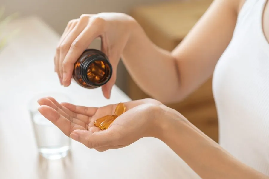 woman taking vitamin d supplement